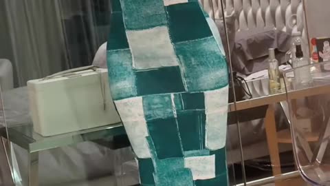 Owning the room in this teal patchwork maxi dress