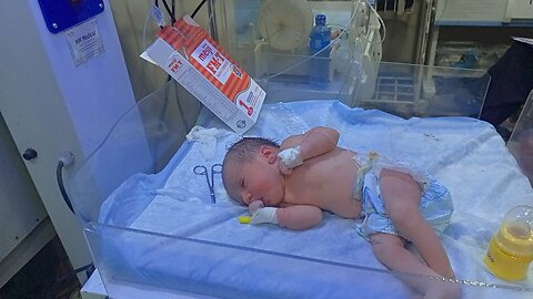 baby feeding newborn baby