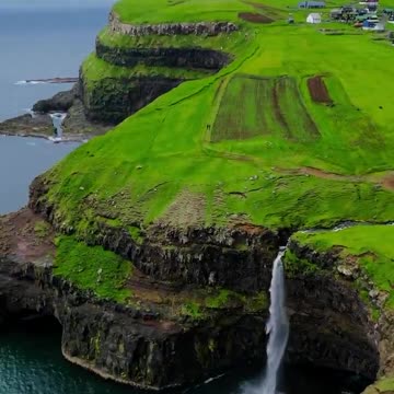 This is a real place Gásadalur is a small village located on the west side of Vágar