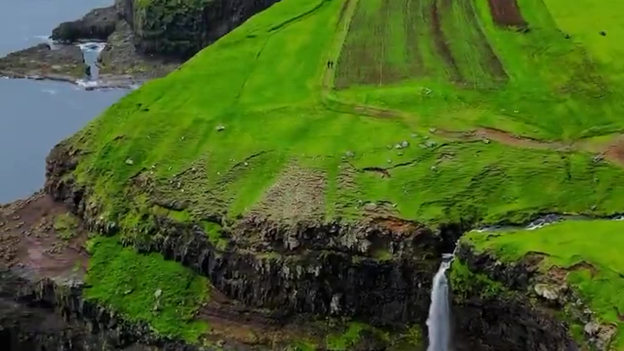 This is a real place Gásadalur is a small village located on the west side of Vágar