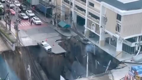 This morning in downtown Bangkok, Thailand, a huge sinkhole appeared on the Main Street