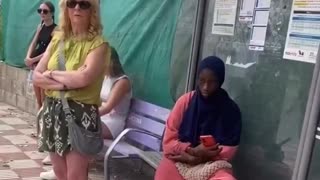 She's decided that old white lady can't sit and wait for bus, she wants her to stand.