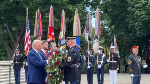 President Donald Trump lays a wreath at the Tomb of the Unknown Soldier.
