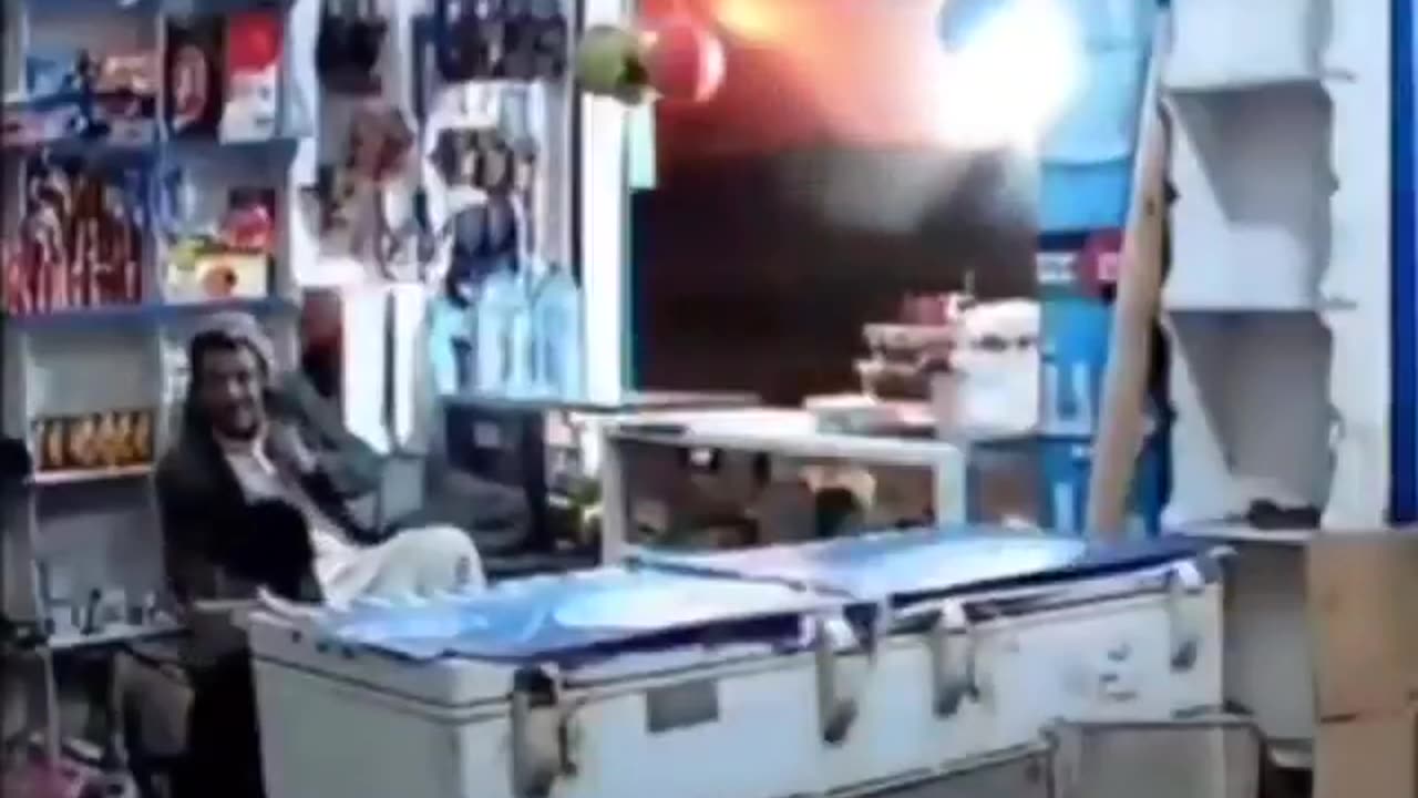 New video shows a Yemeni shop-owner watching the U.S. airstrikes against Houthi