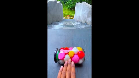 Incredible different colours of bottles falling from stairs to check hardness