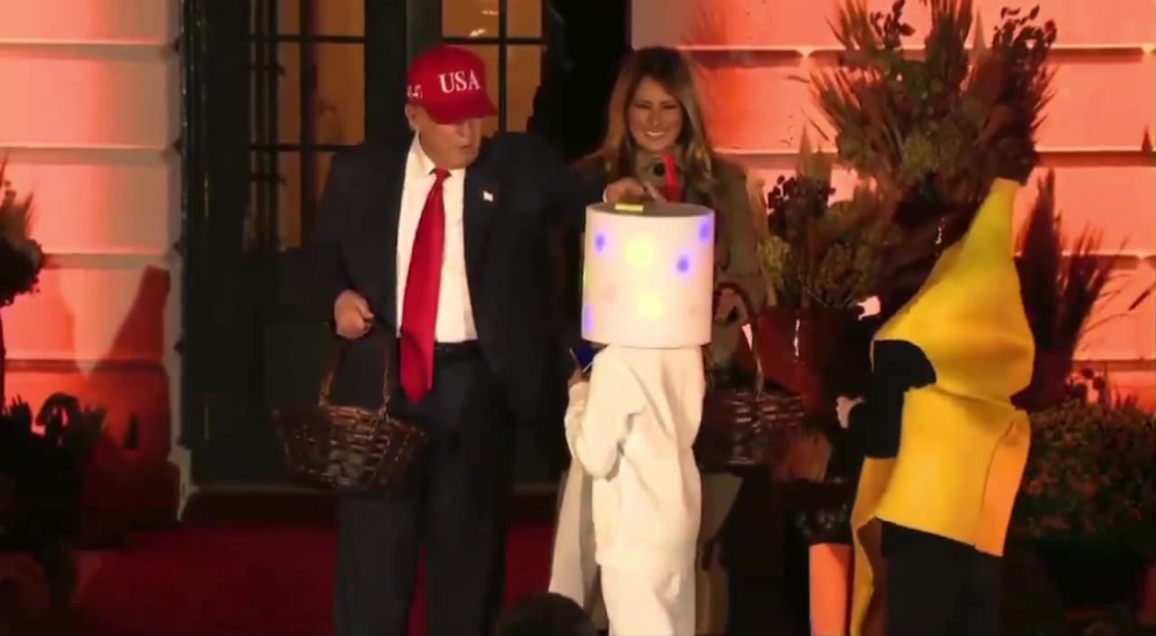 President Trump places candy on Child’s head