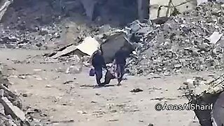 MOMENT Palestinians carrying body from rubble 'TARGETED' by Israeli strik