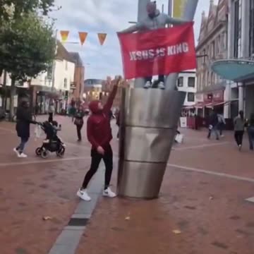 He steals banner dedicated to Jesus Christ then runs away like a rat shouting "Allah Akbar".