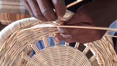 Weaving a rattan chair
