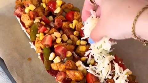 Making bread with chicken and cheese, pepper and corn, as a topping