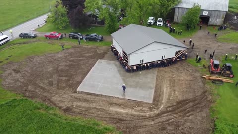 Here's Drove Footage of 150 Amish Men in New York Moving a Barn