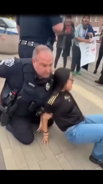 Women arrested for throwing drink at police officer's head. Kannapolis, North Carolina