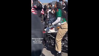Woman Peacefully Rams Cops With Motorcycle Because They're Deporting Her People