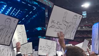 Signs Honoring Charlie Kirk Fill State Farm Stadium