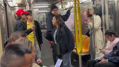 Deranged Woman Harasses and Attacks a Man Wearing a MAGA Hat on the NYC Subway . . . and Faceplants