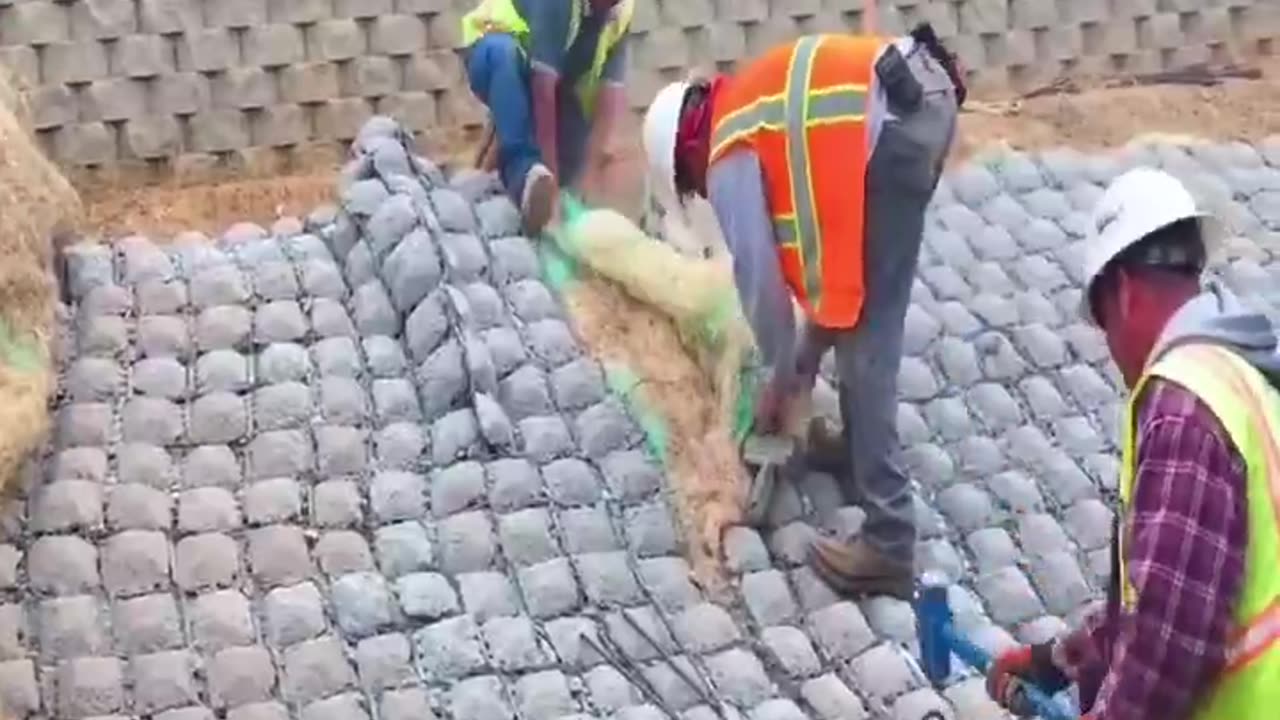 A flexible concrete mat designed to protect riverbanks and hillsides from erosion.