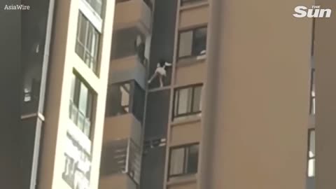 WATCH! Moment mistress nearly PLUNGES to her death from window while hiding from lover’s wife