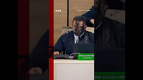 Moment Georgia election chief doused in paint by opposition official.