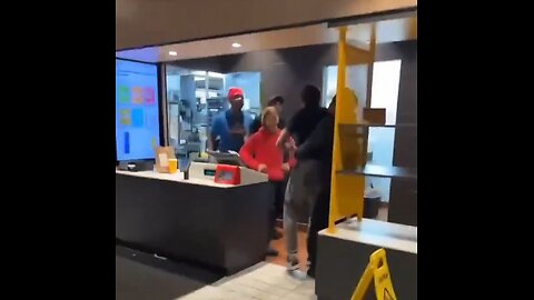 McDonald's crew gang fight customer coming behind counter to throw food