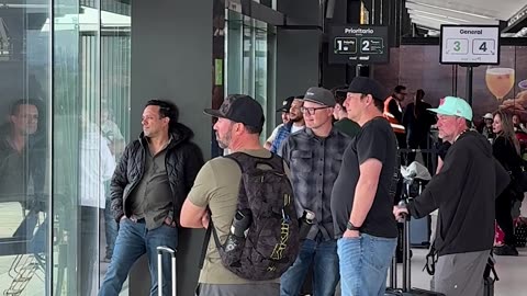 Dads Gather To Watch Airplane Tire Change