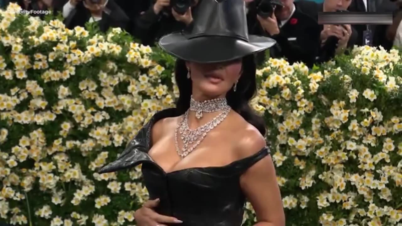 Kim Kardashian scolds security guard after he causes her to take an awkward tumble on way to Met Gala with daughter North