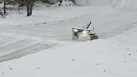 Robot Clears Snow in Driveway