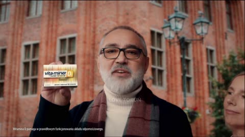 Reklama suplementu diety z Toruniem w tle