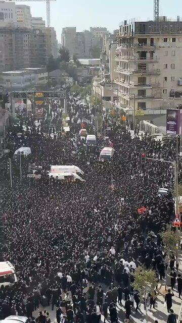 Thousands of ultra-Orthodox Jews, dressed in black