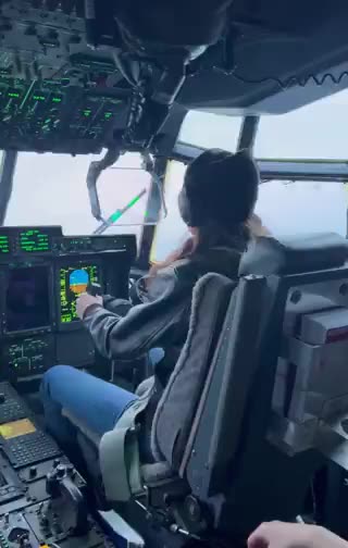 Cool Kristi Noem behind the C-130