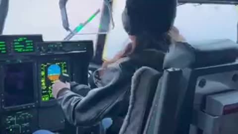 Cool Kristi Noem behind the C-130