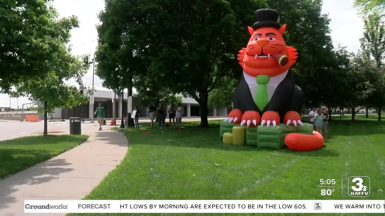 Nebraska group protests corporate greed, inflation with inflatable 'fat cat' Friday