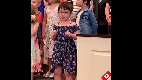 Little girl breaks out the dance Moves during a concert in their School