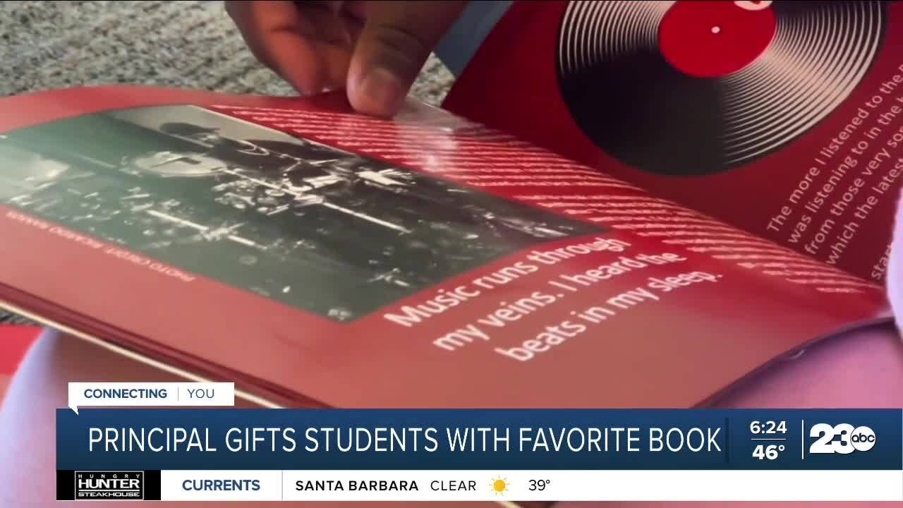 Principal gifts students with favorite book