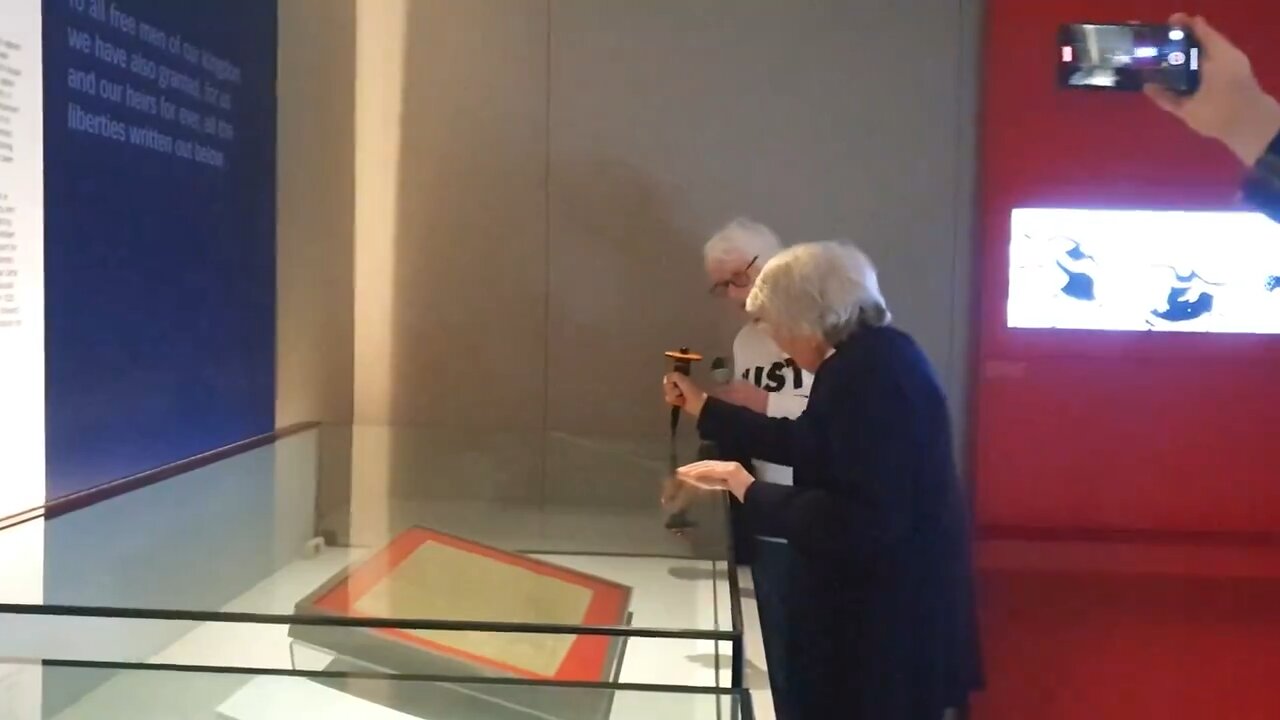 Elderly climate activists attempt to shatter the glass encasing the Magna Carta in British Library