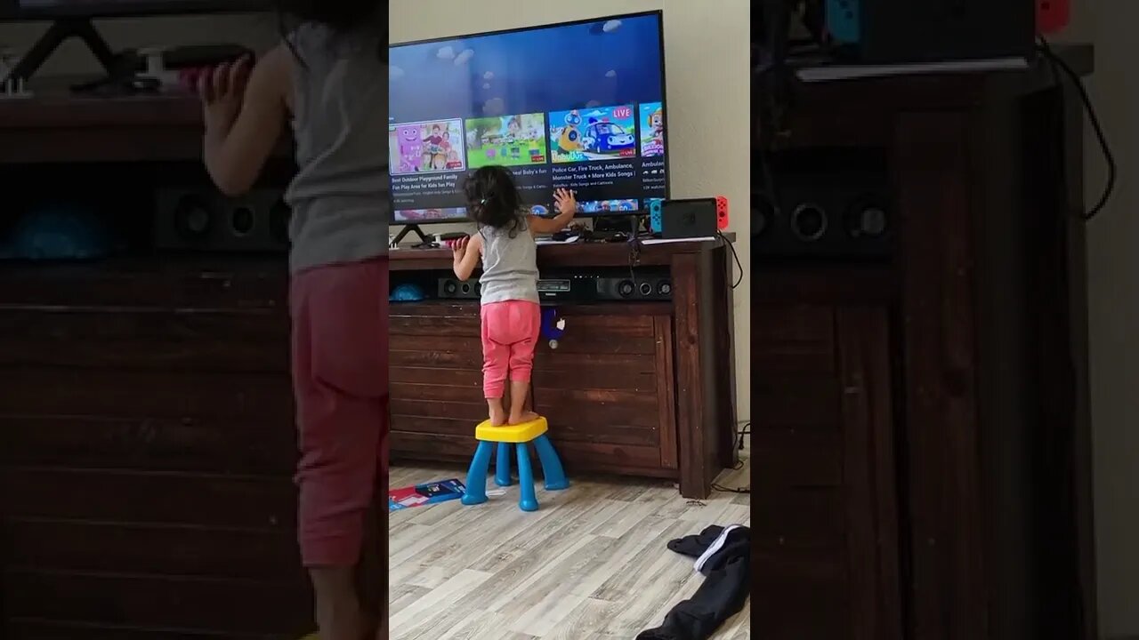 She thought the TV is touchscreen 🤣 #shorts