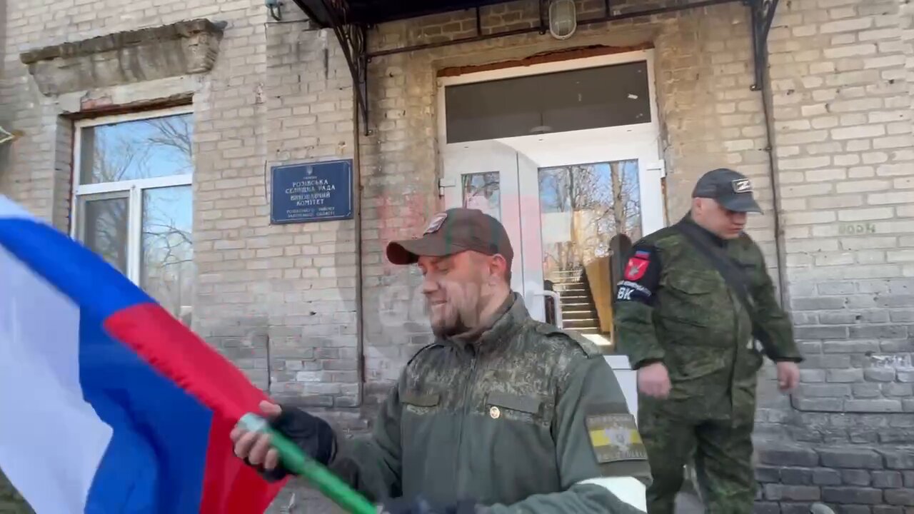 Heads of the DPR Denis Pushilin and Secretary of the General Council of United Russia Andrey Turchak raise the Red Banner and the flag of the Russian Federation over the village of Rozovka, Zaporozhye region