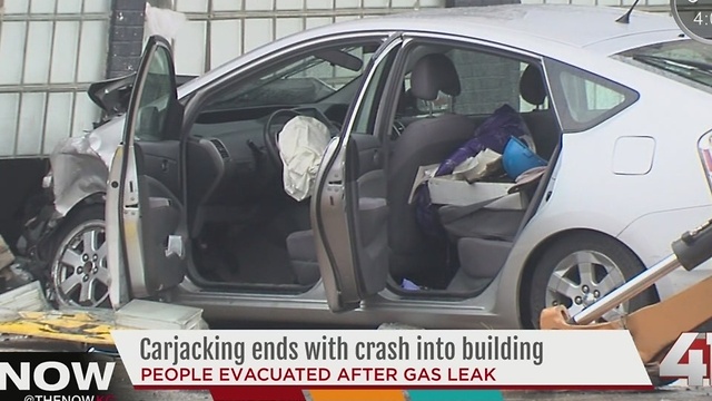 Car crashes into building in the Crossroads