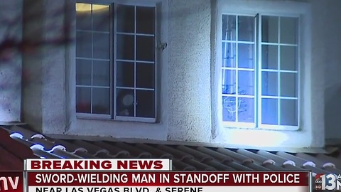 Man armed with samurai sword barricades himself in home