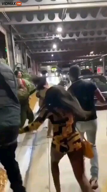 Parking lot brawl. Look at all the wigs & weaves coming off.