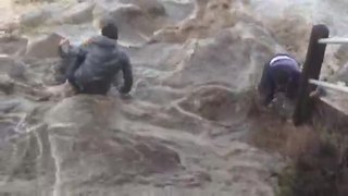 Two Men Are Almost Swept Away By Massive Wave