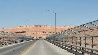 Driving across the Glen Canyon Dam bridge