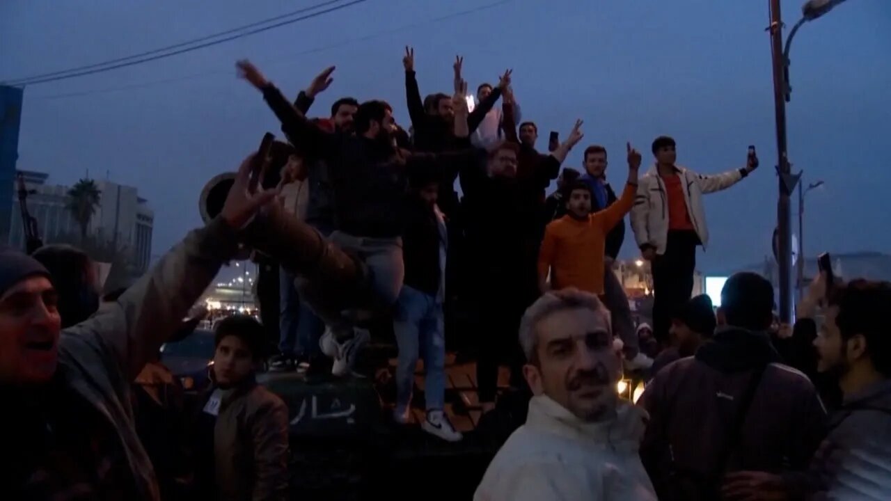 Syrians celebrate as government falls in stunning end to 50-year rule of Assad family