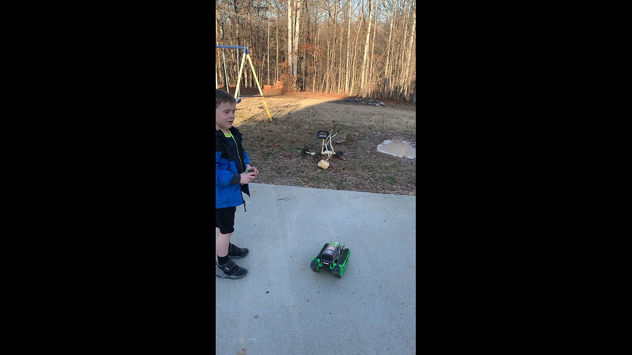 Kid drives RC monster truck on thin ice