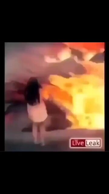 Lady slips into what appears to be a volcano