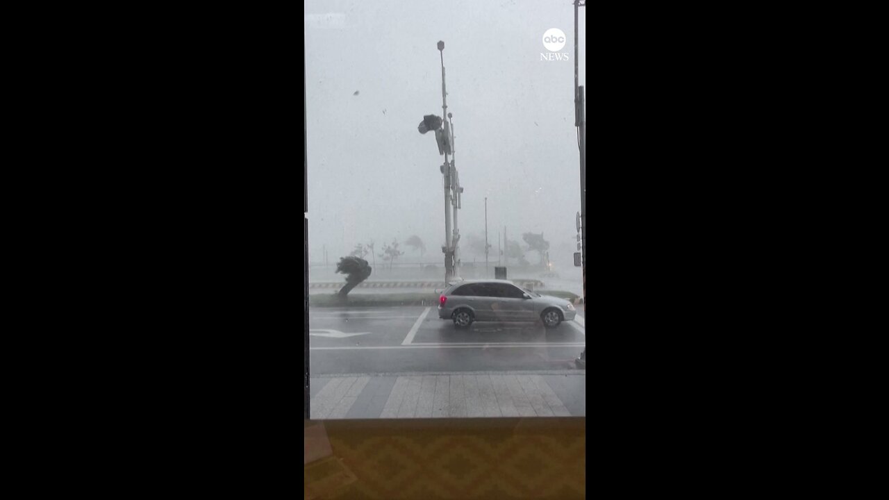 BLOWN AWAY: Fierce winds blew a car backwards in Taiwan on Sunday as Typhoon Haikus