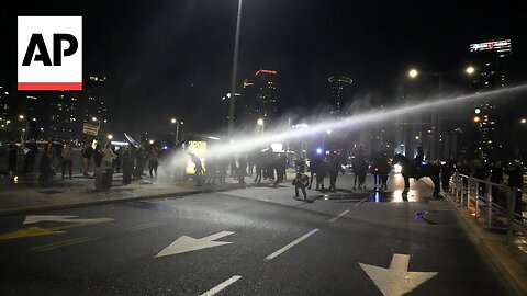 Thousands of Israelis protest in Tel Aviv before police bring out water cannon