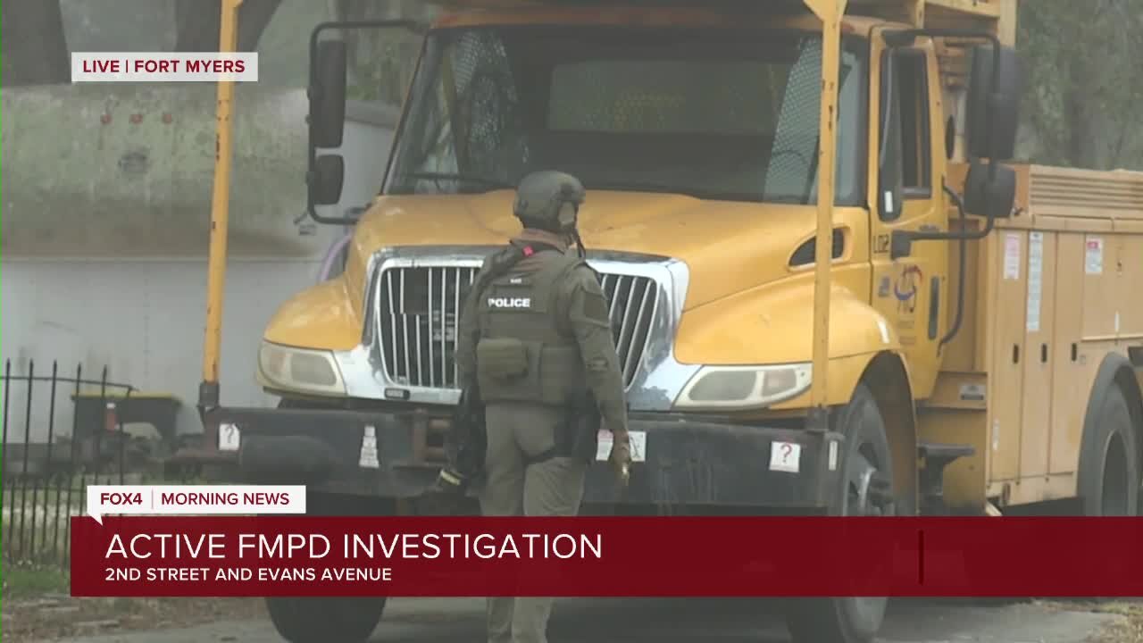 Police negotiating with barricaded subject in apartment