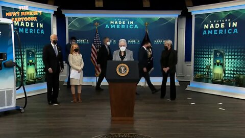 Biden and Democrats follow the marks on the floor to celebrate electric vehicles.