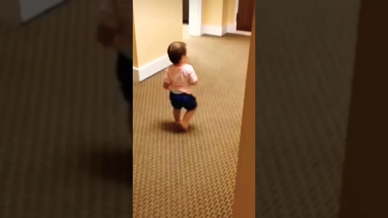 Baby runs into wall