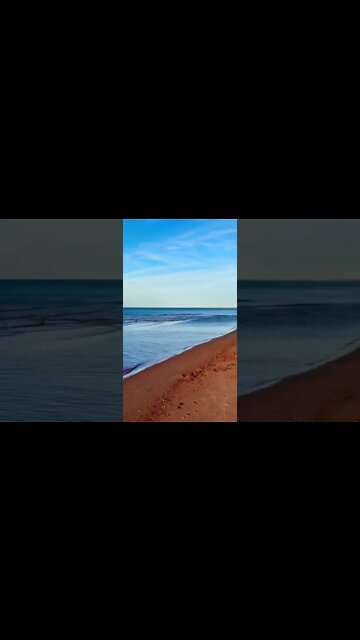 Calm water on a red beach
